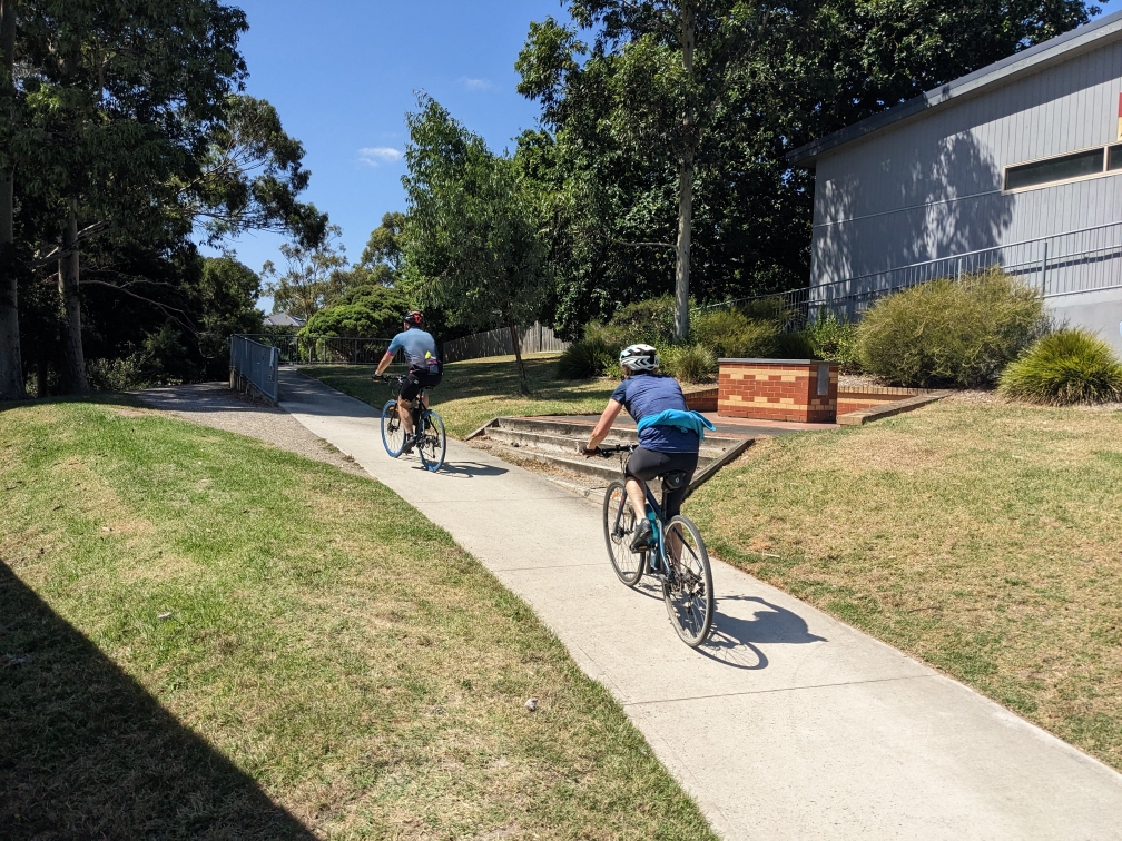 Cyclists passing Ferndale Park Pavilion